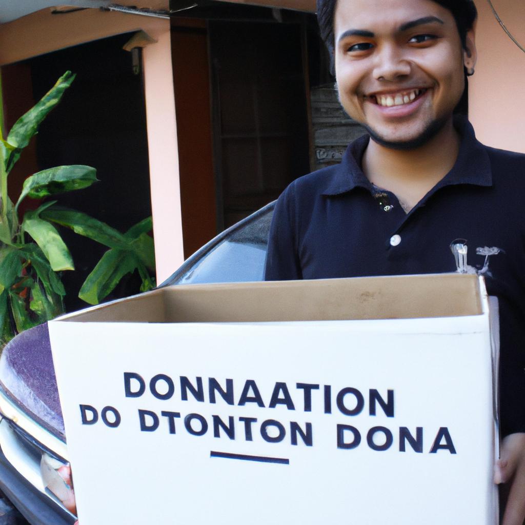 Person holding donation box, smiling